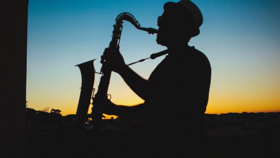 silhouette-of-a-man-playing-saxophone-during-sunset-733767