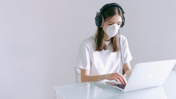 woman-in-white-shirt-using-laptop-computer-3986950